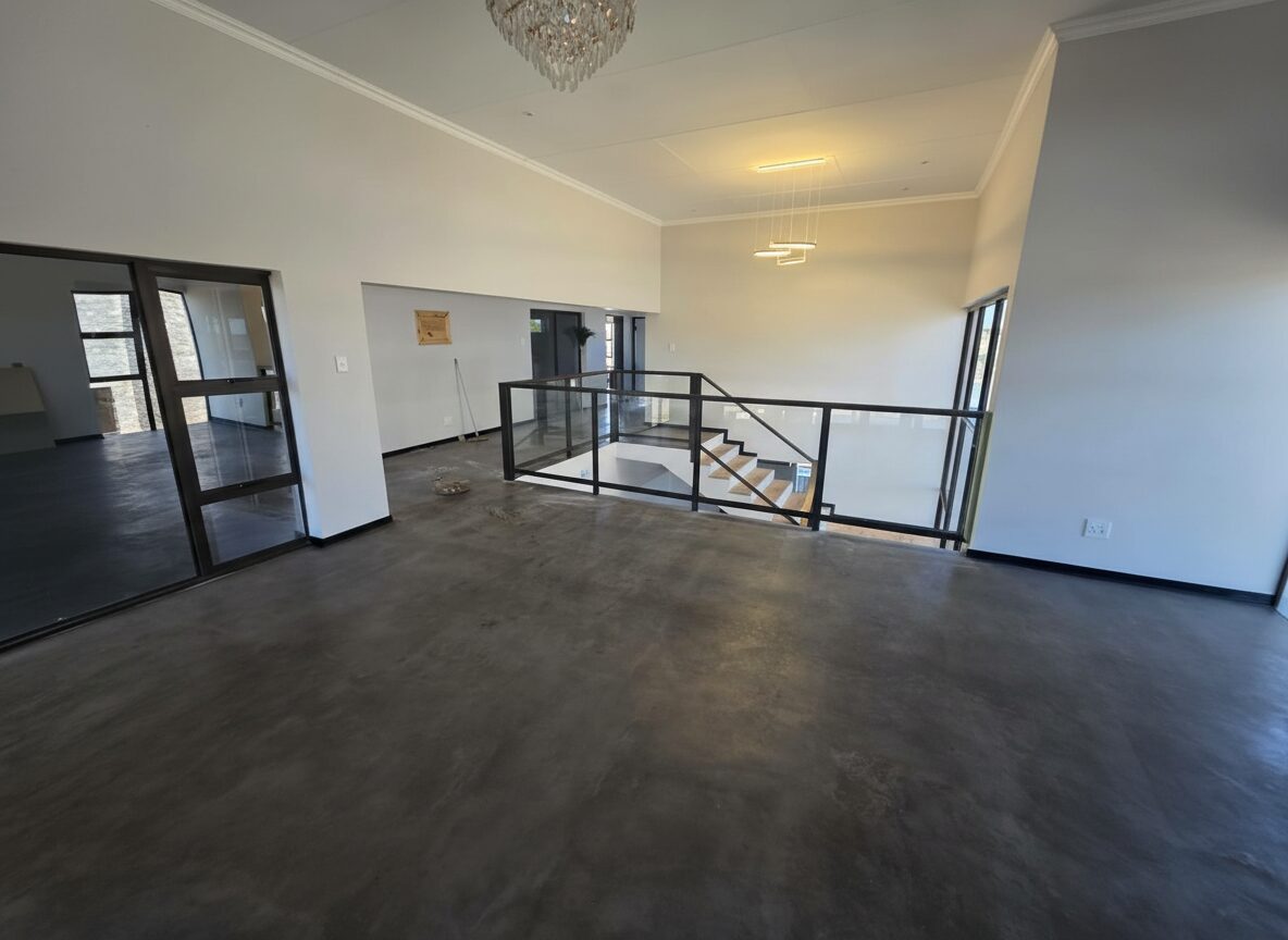 Completed residence with columns and paving